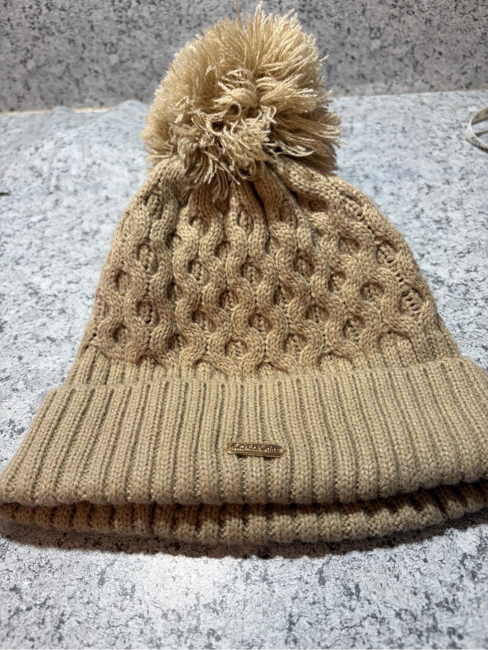 Calvin Klein Women’s Honey Beige Cable Knit Pom Pom Beanie Hat. Cozy and warm